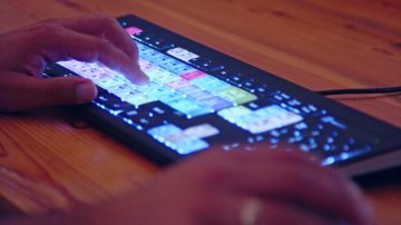 tracking-shot-of-men-and-woman-sitting-at-table-in-dimly-lit-living-room-and-talkin-SBV-346670272-4K.00_00_19_22.Still004-768x432