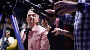 tracking-shot-of-men-and-woman-sitting-at-table-in-dimly-lit-living-room-and-talkin-SBV-346670272-4K.00_00_42_15.Still010-768x432