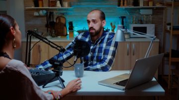 tracking-shot-of-men-and-woman-sitting-at-table-in-dimly-lit-living-room-and-talkin-SBV-346670272-4K.00_00_45_02.Still011-768x432